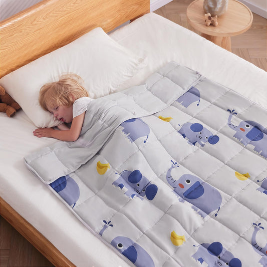 Child sleeping under a kids weighted blanket for sensory and autism support – grey elephant design
